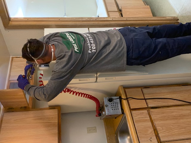 PCSI technician treating a kitchen